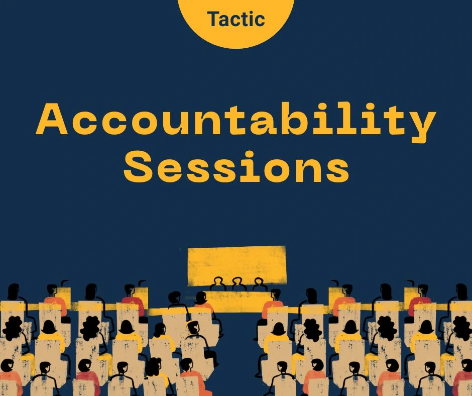 Title reads 'Accountability sessions'. At the top in yellow semi-circle text reads 'Tactic'. Illustration of a group of people sitting in chairs facing a stage with three people sitting on the stage.|Diagram showing an accountability session. There is a person at a microphone standing before an audience titled "mike holder". There is a panel of four sitting at a long table on the left titled " panel". Next to the panel on the right is a single person sitting at a table that reads 'The Chair