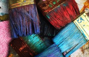 paintbrushes covered in paint