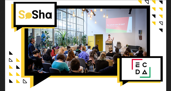 A room full of people listening to a person at a lectern. On the screen behind the speaker is a presentation 'So what can AI do?'. There are two logos -one is for SoSha and one is for ECDA.