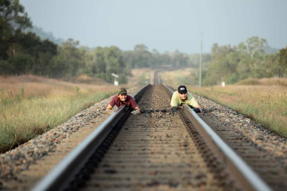 Two protestors have chained themselves to the railway line.