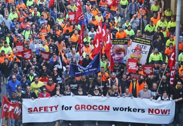 Hundreds of protestors on street with sign saying "Safety for Grocon Workers"