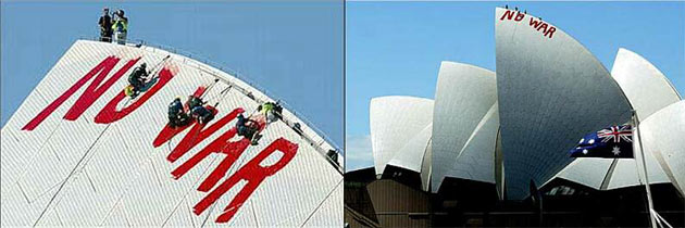 Photograph of the Sydney Opera House with 'No War' painted on it in red paint.