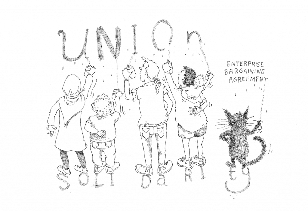Drawing of people writing 'Union' on the wall, while standing on the letters of 'Solidarity'. A black cat stands next to them scratching 'Enterprise Bargaining Agreement' on the wall. 