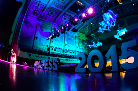 A stage with colours flights and the words Progress 2015 spelled out in oversized white letters