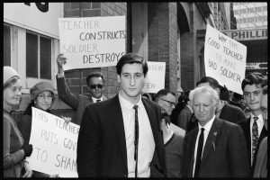 William White and protesters with placards stand outside a Sydney court.