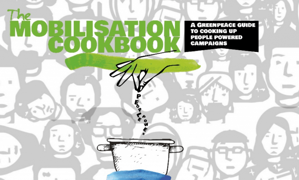 Title page of the mobilisation cookbook, featuring the words 'Mobilisation Cookbook: A Greenpeace Guide to cooking up people powered campaigns", over a background of diverse cartoon faces. Below the text is a cartoon of a cooking pot, with a hand sprinkling something granular into it.