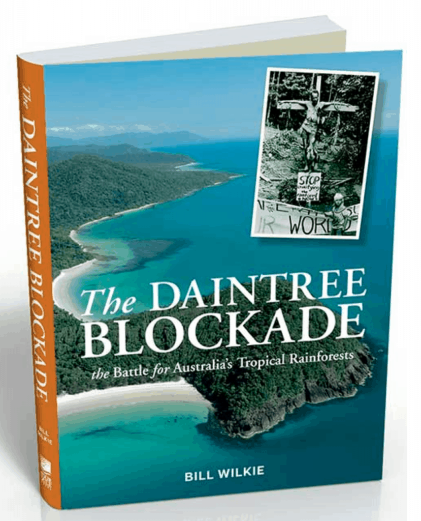 book cover of The Daintree Blockade: The battle for Australia's rainforests by Bill Wilkie showing aerial photo of the Daintree rainforest and the oceans