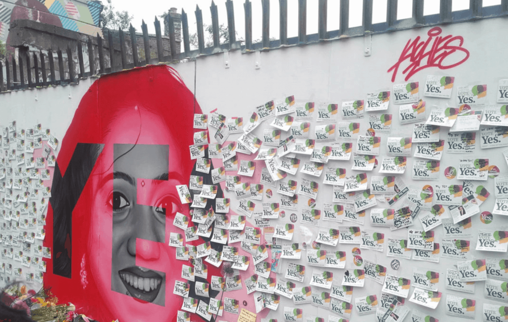 A mural outside the Bernard Shaw Pub in Portobello, Dublin depicting Savita Halappanavar and calling for a Yes vote in Ireland’s referendum on repealing the Eighth Amendment. The mural shows Savita's face surrounded by lots of stickers saying Vote Yes