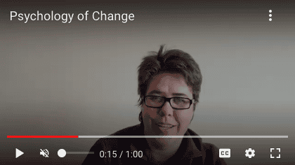 video playing for the psychology of change youtube channel. Headshot of woman with glasses.