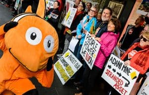 Person dressed in Nemo fish costume at a protest