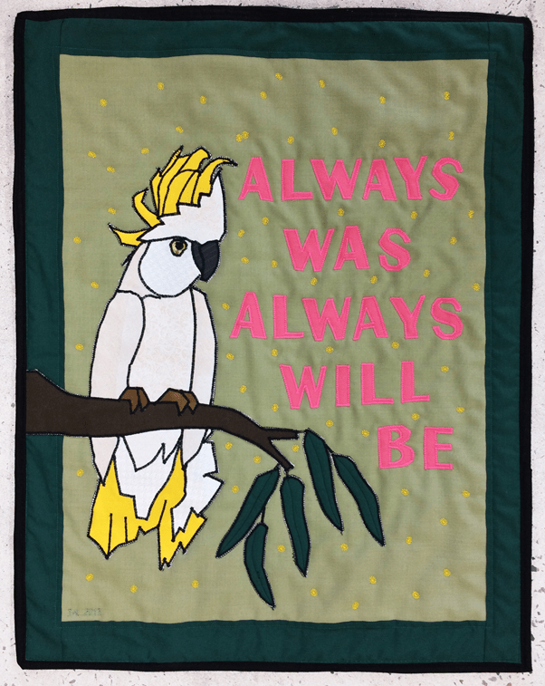 Quilt with cockatoo sitting on branch and words "Always was always will be"