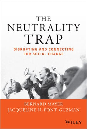 Book cover - Text reads 'The Neutrality Trap: Disrupting and Connecting for Social Change'. Black and white image of a group of protestors. One is speaking into a megaphone.