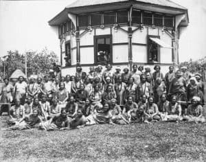 Women's Mau leaders and committee in front of octagonal Mau office, circa 1930