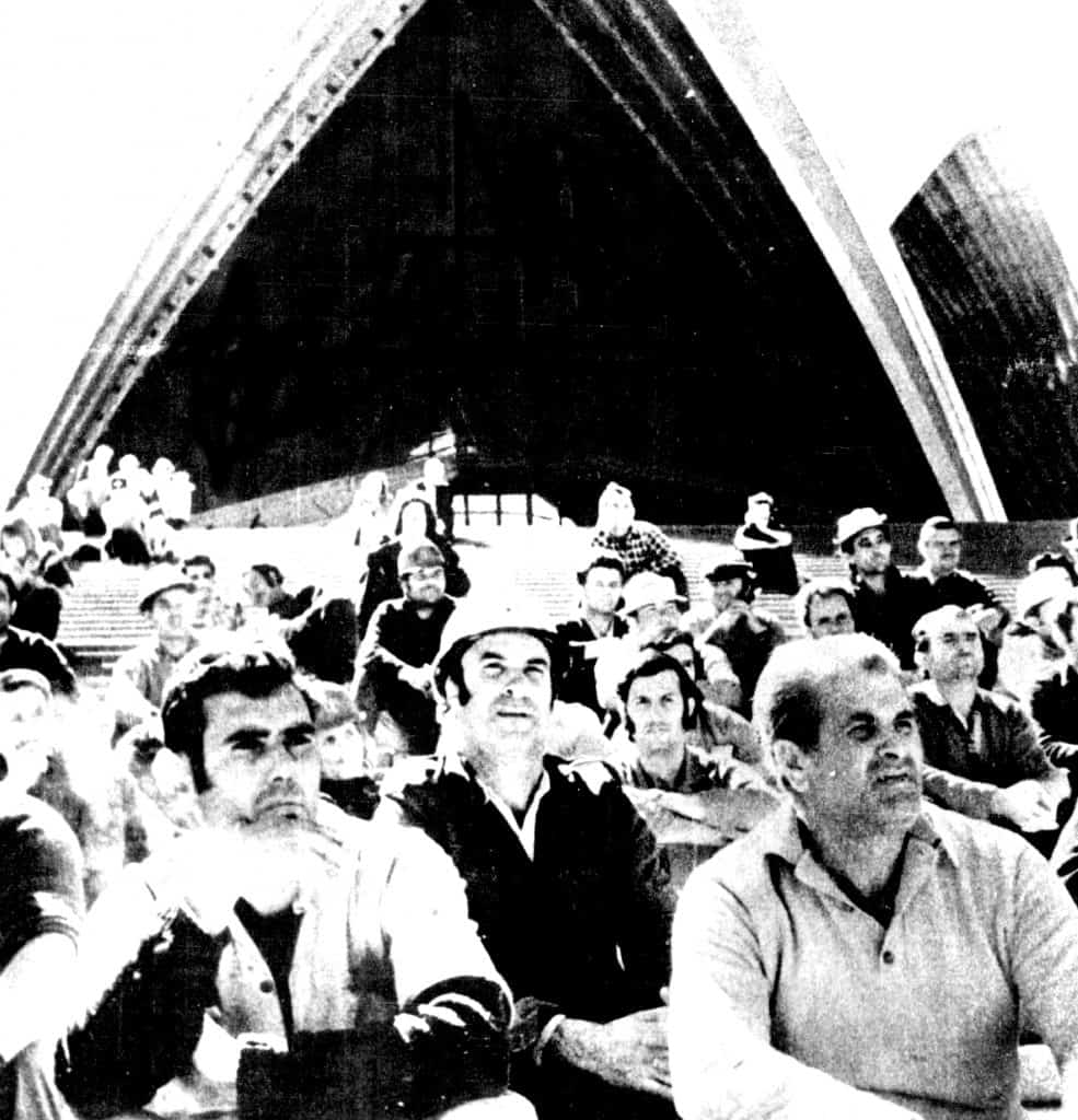 workers sitting on steps outside Opera House