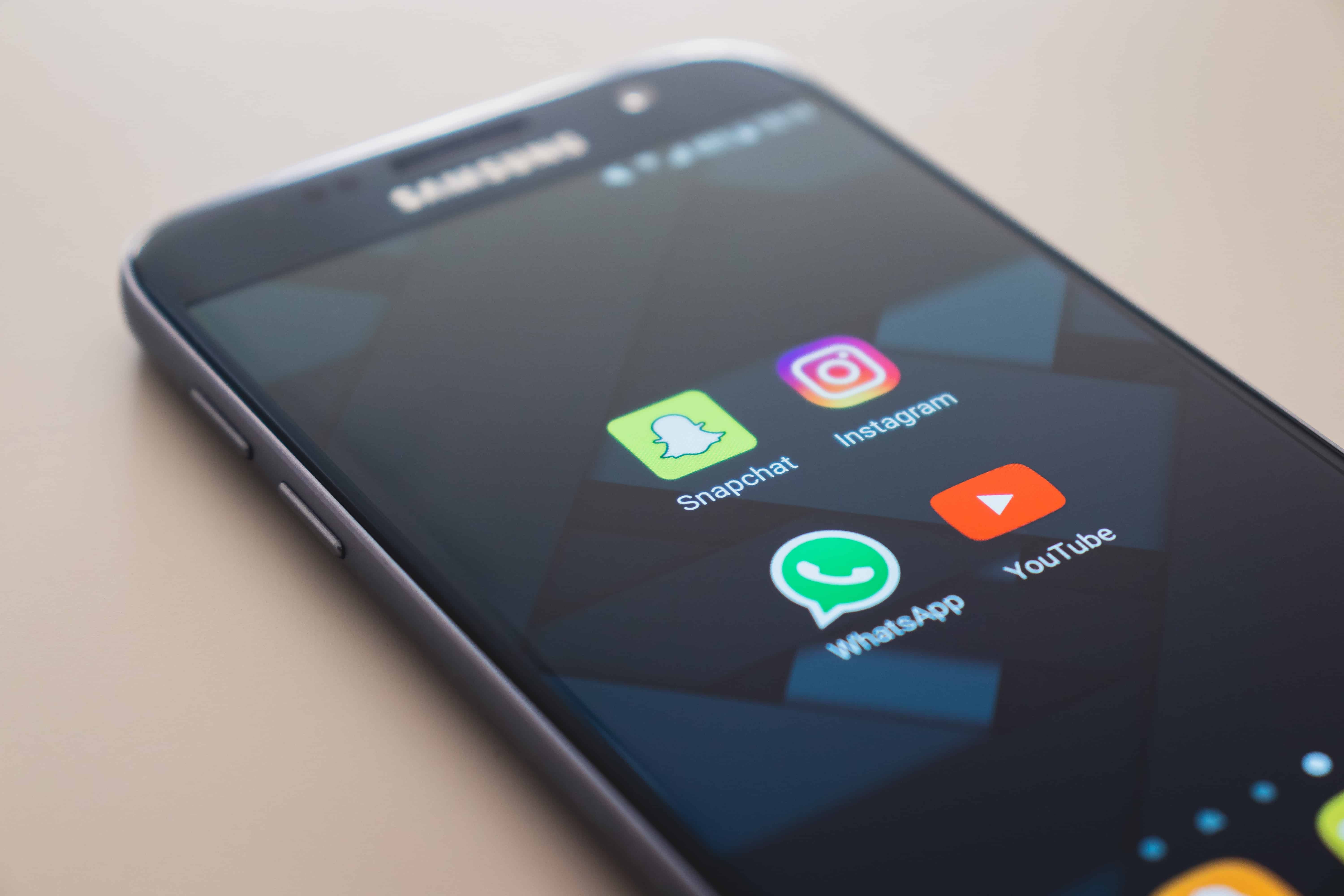 mobile phone with whatsapp icon