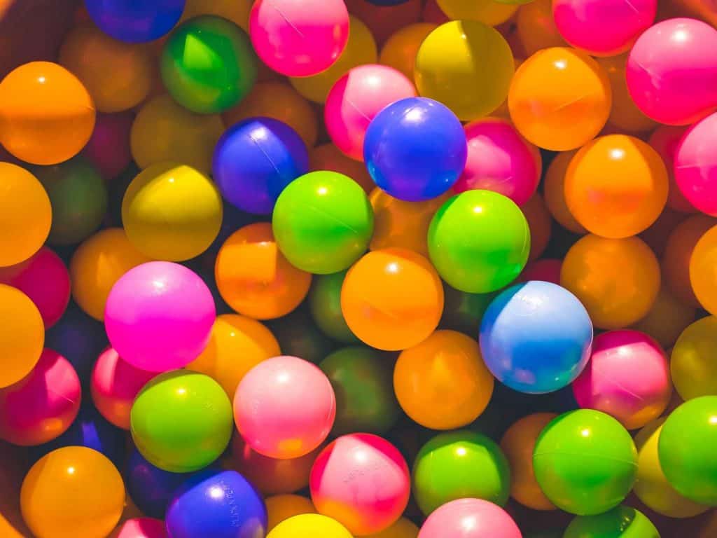 Photograph of multiple coloured plastic balls.