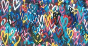 spray painted colourful hearts on wall