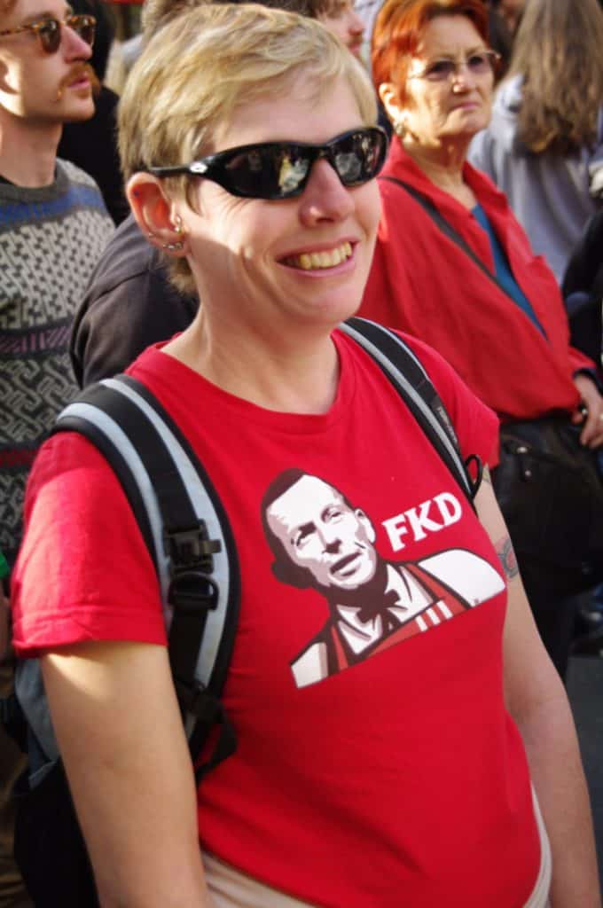 Someone wearing a tshirt with a picture of Tony Abbott with FKD text - in the style of KFC Kentucky Fried Chicken.