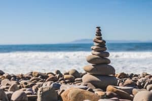 A stack of balancing rocks on a seashore