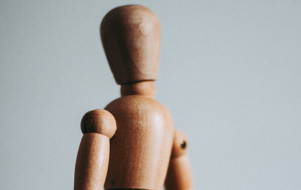 Close up of the head and shoulders of a movable artist's model