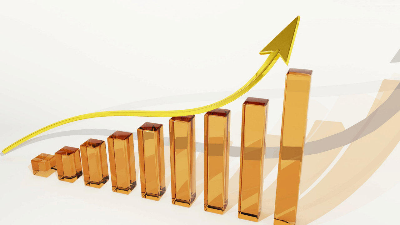 column graph with bars going up and arrow indicating upward growth|