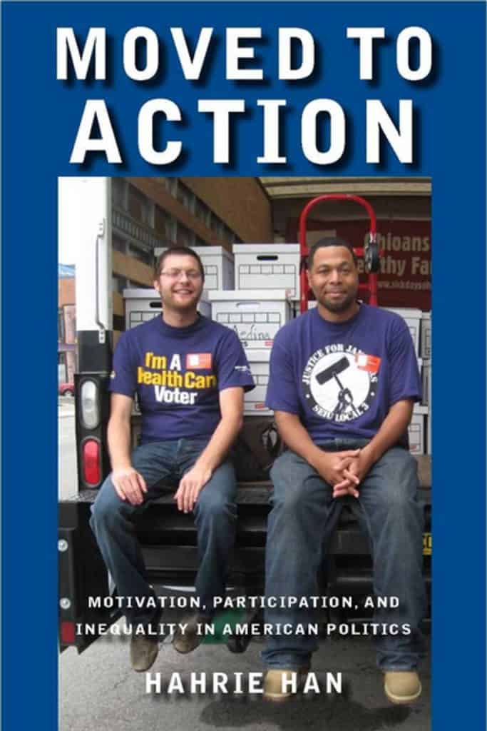 Cover of the booklet 'Moved to Action', includes a photograph of two smiling people wearing union tshirts.