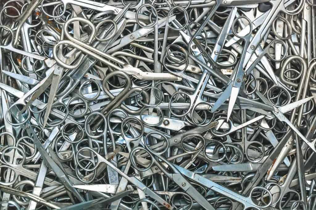 Photograph of multiple pairs of metal scissors.