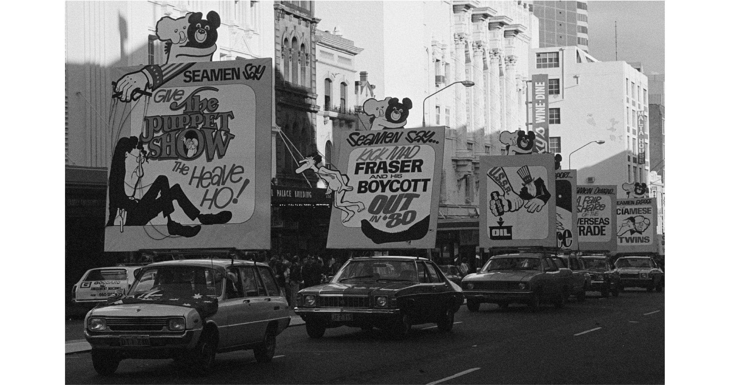 big protest signs on a parade of cars heading down a city street|old newspaper articles about the Bullfinch Beer Strike|two photos showing protestors against uranium mining|posters saying Escape Refugees Welcome Here|two photos showing car protest. one about Angela David and the other one about Steve Biko|man sitting on rocket sculpture that says Don't Go West with Reagan and the other one has a skull picture with the word no|collage of photos showing banners hanging on bridges over roads protesting various issues.|two bridges displaying banners. one says Stolen land change the date with Australian Aboriginal flag. The other banner says Free West Papua!|two photos of banners signs -one photo has a crane with 'Moratorium for Black Rights'. The other photo has banners protesting evictions on a terrace house.|Excerpt from an old newspaper or flier. The heading says 'A go slow strike