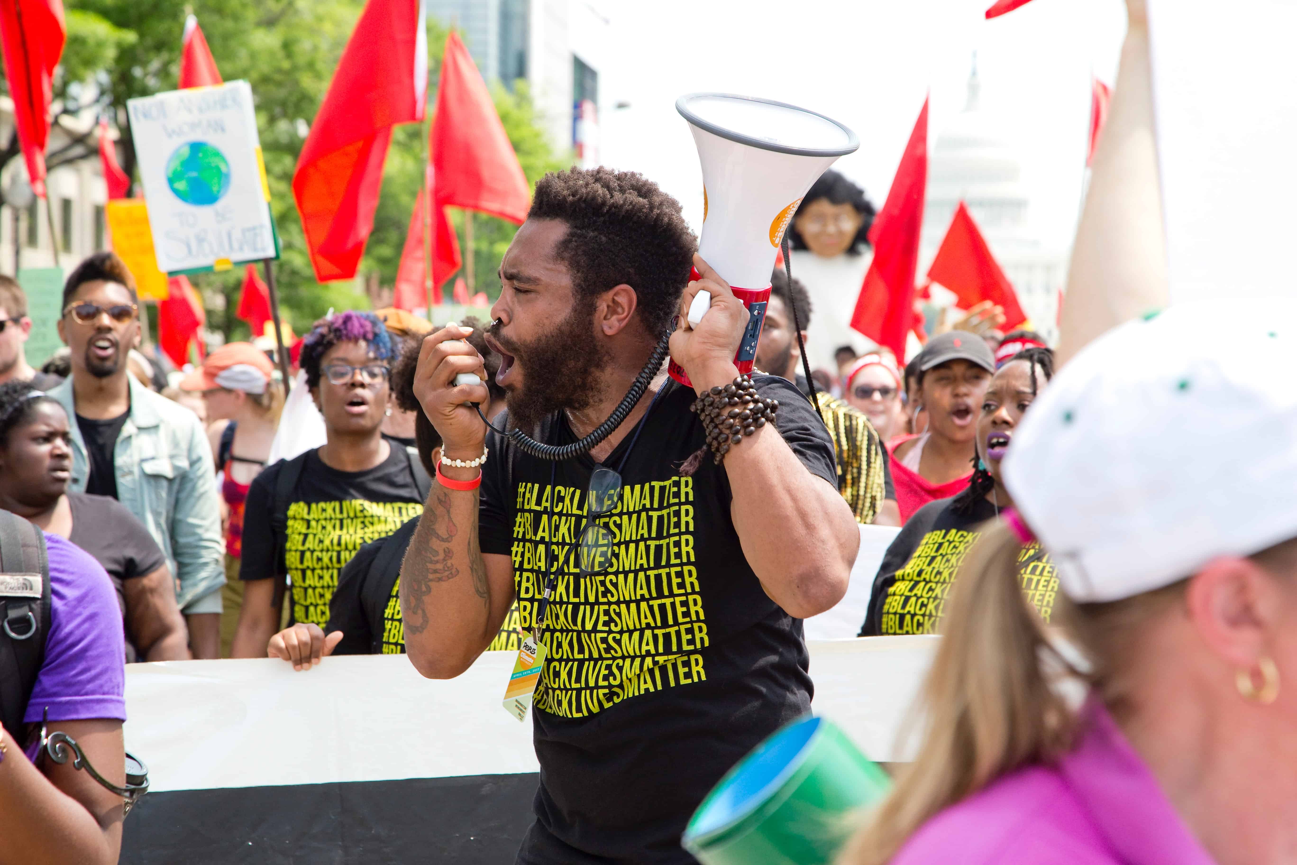 protestor speaking into megaphone at #BlackLivesMatter protest