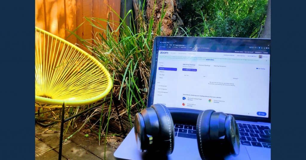 laptop and headphones outside in garden