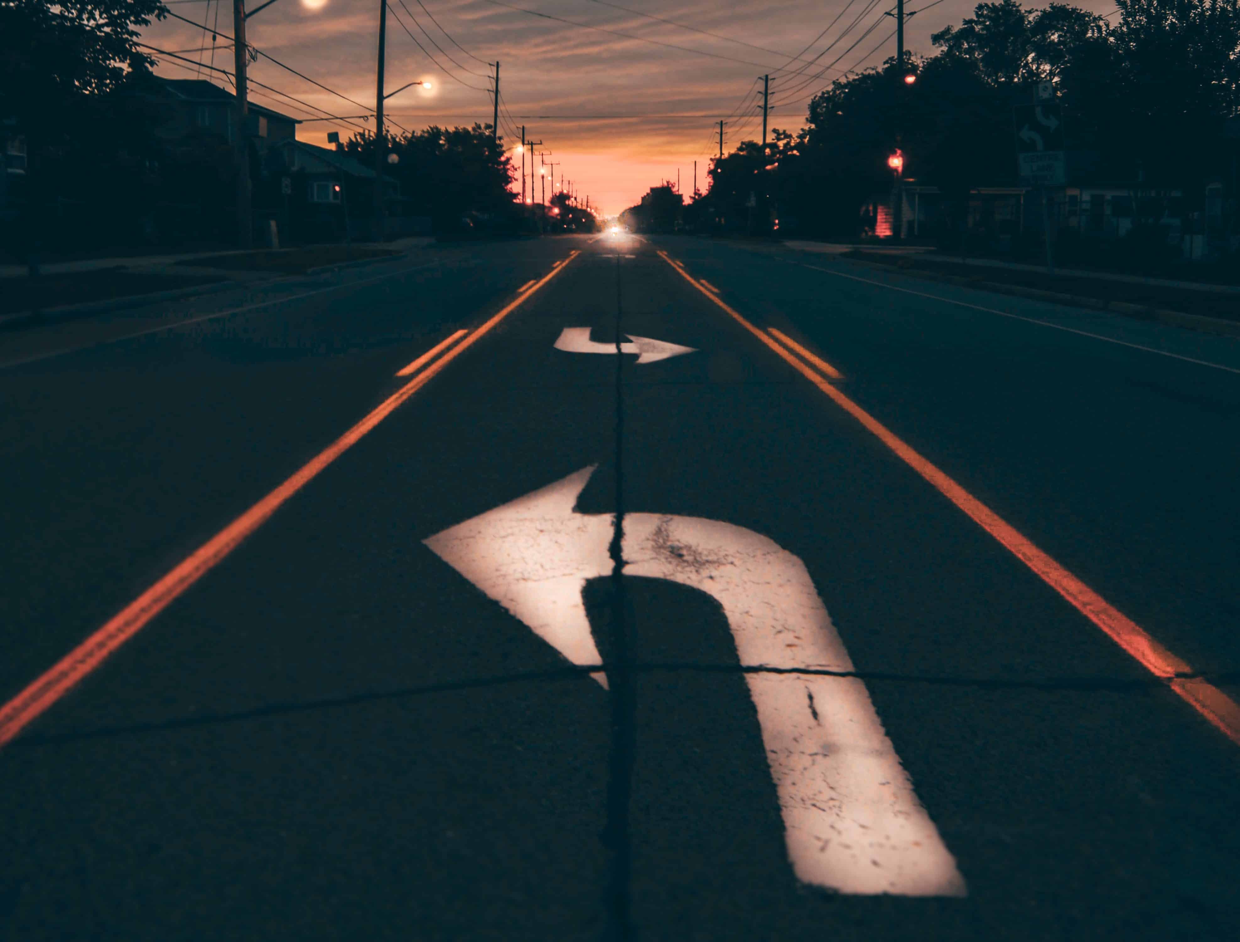 arrows pointing different directions on road